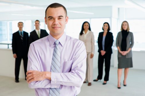 Man standing in front of his colleague