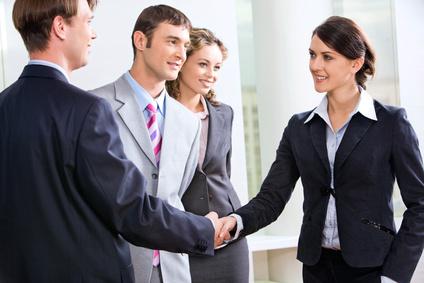 businesswoman shaking hands in the hall